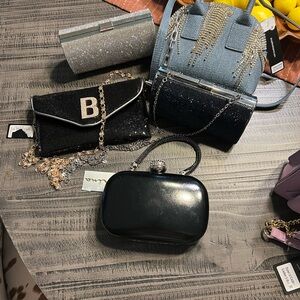 Bebe Black Clutch with Glossy Finish